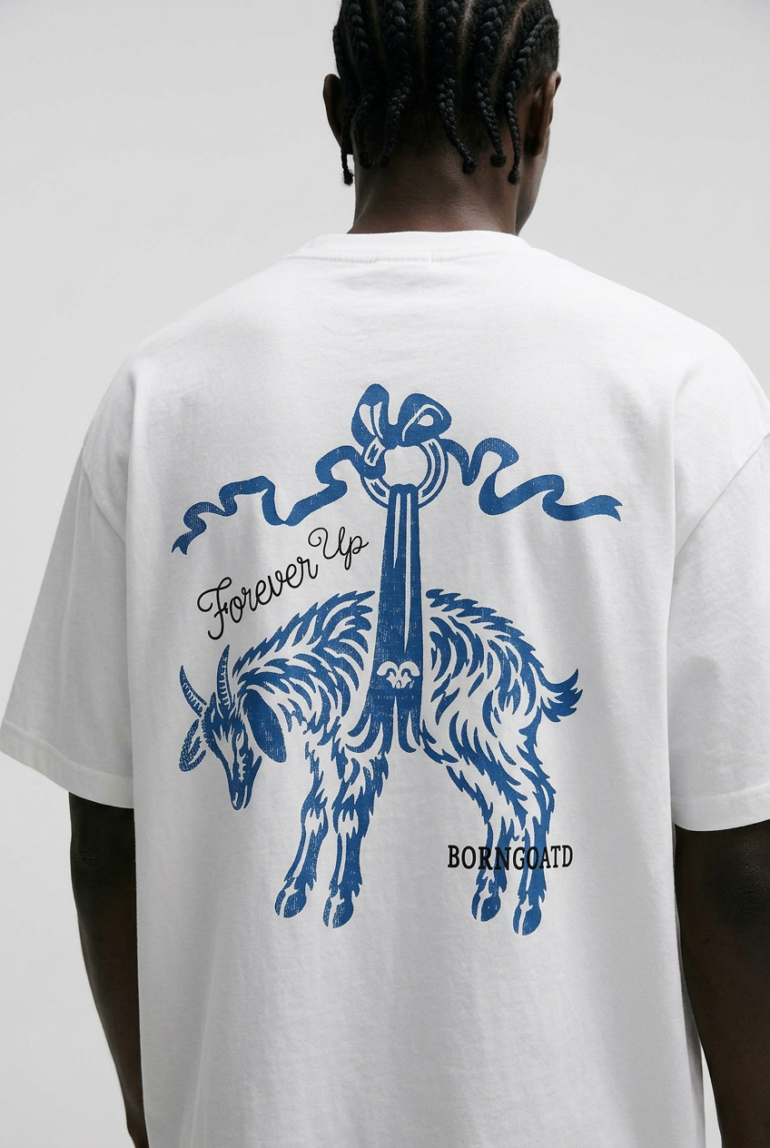 Person wearing a white t-shirt with blue graphic design on the back