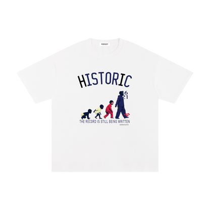 BORNGOATD Historic Evolution graphic t-shirt featuring generational progression artwork and “The Record Is Still Being Written” slogan