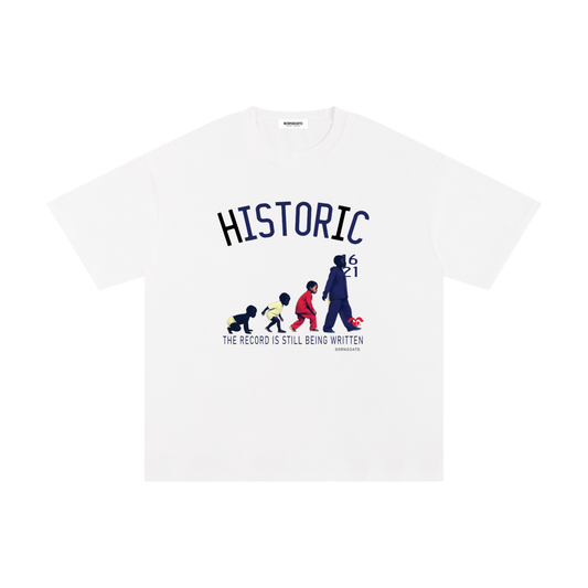 BORNGOATD Historic Evolution graphic t-shirt featuring generational progression artwork and “The Record Is Still Being Written” slogan