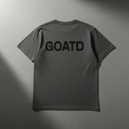 Close up shot of the back of the BORNGOATD Logo tee in Gray