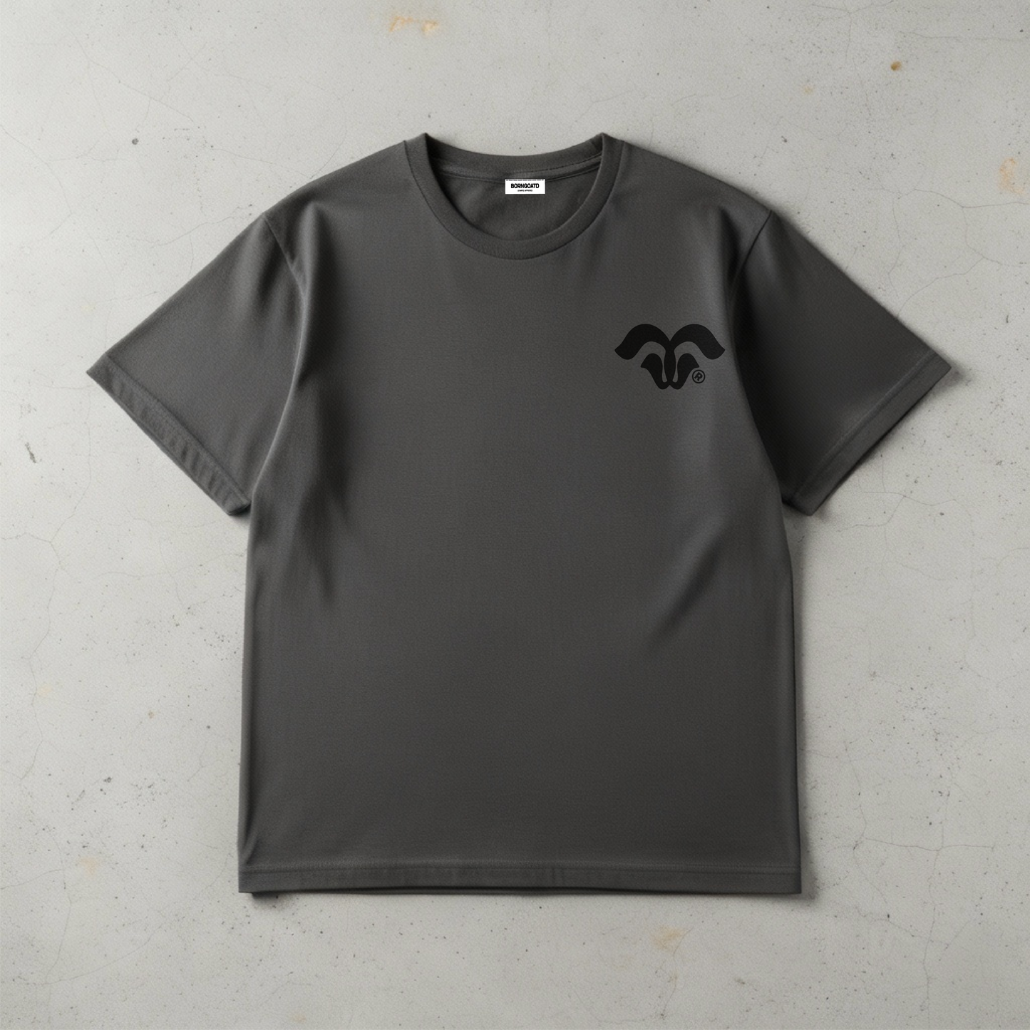 Close up shot of the BORNGOATD Logo tee  in Gray