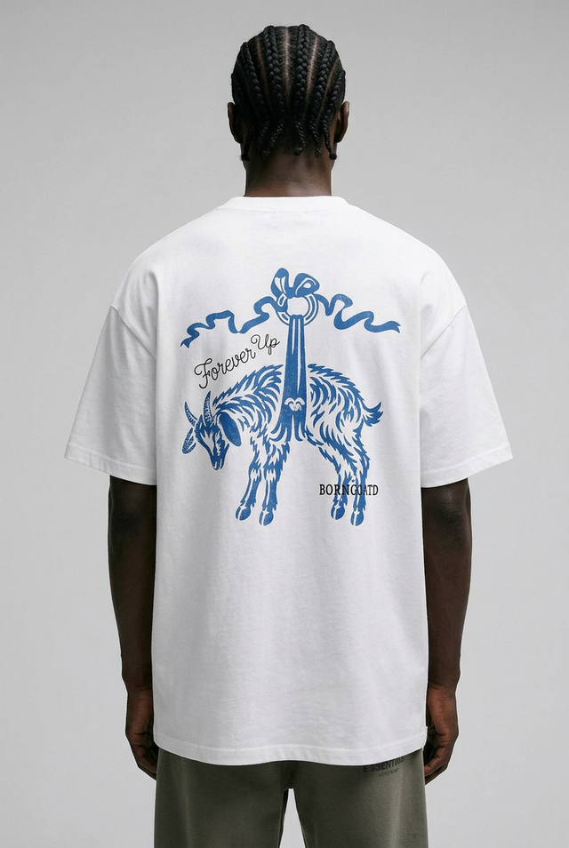Person wearing a white t-shirt with blue graphic design on the back, standing against a gray background