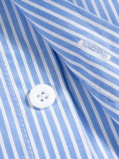 Close-up of a blue and white striped shirt with a button, showing a brand label.